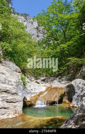 It is a small lake: about 5 m across and 5 m deep. The Bath of Youth is filled with clear cold water from a mountain spring. The water temperature nev Stock Photo