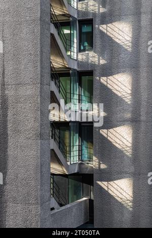 Concrete stairs casting shadow, forming a interesting geometric shape Stock Photo