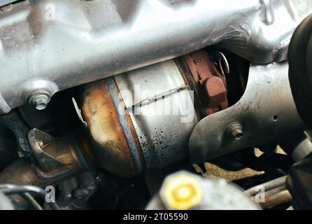 Catalytic converter on diesel engine in a car, close up a car catalytic converter for filtration carbon monoxide, Automotive parts concept Stock Photo