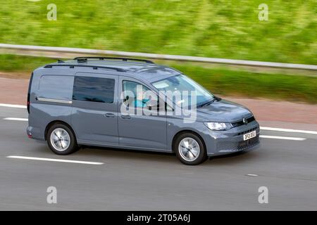 2021 Grey VW Volkswagen Caddy Maxi C20 Comm Pro TDi SA 1968cc 7 speed semi-automatic; travelling at speed on the M6 motorway in Greater Manchester, UK Stock Photo