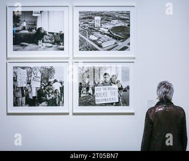 London, UK. 04th Oct, 2023. Visitors look at monochrome images by LaToya Ruby Frazier, who, over the course of 6 months in 2016, immersed herself in the lives of those affected by the water crisis in Flint, Michigan. 'RE/SISTERS: A Lens on Gender and Ecology' is a new exhibition at Barbican Art Gallery that brings together the work of nearly 50 artists, surveying the relationship between gender and ecology through film, photography and installation. The exhibition runs until Jan 14th, 2024. Credit: Imageplotter/Alamy Live News Stock Photo