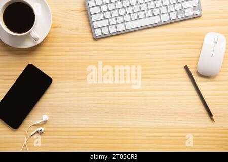wood desk office with laptop, smartphone and other work supplies with cup of coffee. Top view with copy space for input the text. Designer workspace o Stock Photo
