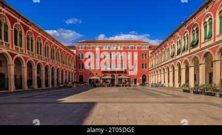 republic square in split on a blue sky sunny afternoon is half shady and half brightly lit Stock Photo