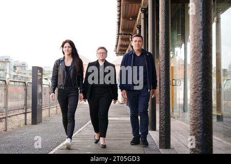 (left to right) Business leader Lou Cordwell, Leader of Manchester City Council, Bev Craig and Mayor of Greater Manchester Andy Burnham arrive for a press conference at Museum of Science and Industry, Manchester, after Prime Minister Rishi Sunak axed plans for HS2 to run from Birmingham to Manchester during his speech at the Conservative party conference. Picture date: Wednesday October 4, 2023. Stock Photo