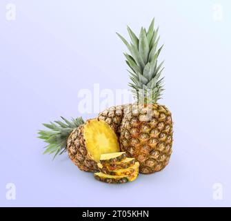 Cut and whole pineapples on light blue background Stock Photo
