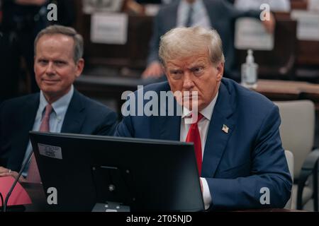 New York, United States. 04th Oct, 2023. United States President Donald Trump sits in the court room on day 3 of his civil fraud trial at State Supreme Court on Wednesday, October 4, 2023 in New York City. The case brought last September by New York Attorney General Letitia James, accuses Trump, his eldest sons and his family business of inflating Trump's net worth by more than $2 billion by overvaluing his real estate portfolio. Pool Photo by Jeenah Moon/UPI Credit: UPI/Alamy Live News Stock Photo