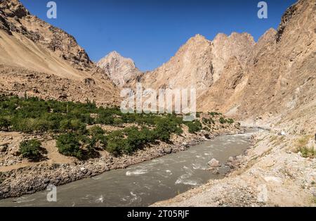 The Panj river going through the scenic valley in the mountains of Afghanistan, close to the border with Tajikistan. Stock Photo