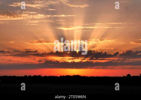 Setting evening sun in Dutch landscape with the sun behind the clouds.vvbvanbree fotografie Stock Photo