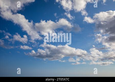 Sunny sky abstract background, beautiful cloudscape, on the heaven, view over white fluffy clouds, freedom concept. Aerial view of sky and white cloud Stock Photo