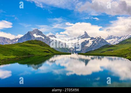 Bachalpsee lake at dawn, Bernese Oberland, Switzerland. Alpine view of the Mt. Schreckhorn and Wetterhorn. Location Bachalpsee in Swiss alps, Grindelw Stock Photo