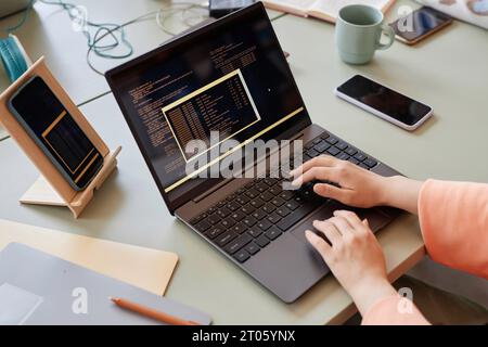 Close up of unrecognizable woman writing code on multiple devices in software development, copy space Stock Photo