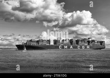 Black And White Photo Of The Ultra Large Container Ship CMA CGM Benjamin Franklin Entering The Port Of Southampton, UK. Stock Photo