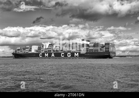 Black And White Photo Of The Ultra Large Container Ship CMA CGM Benjamin Franklin Entering The Port Of Southampton, UK. Stock Photo