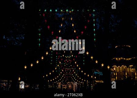 Hanging lights in Tivoli amusement park. Stock Photo