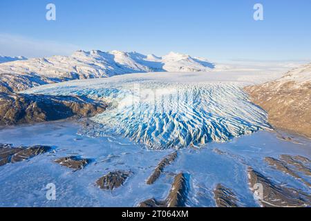 Aerial view over ice tongue Falljökull in winter, one of many outlet glaciers of Vatnajökull / Vatna Glacier, largest ice cap in Iceland, Austurland Stock Photo