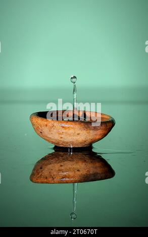 Water Splash on Spoon Crisp Details Stock Photo