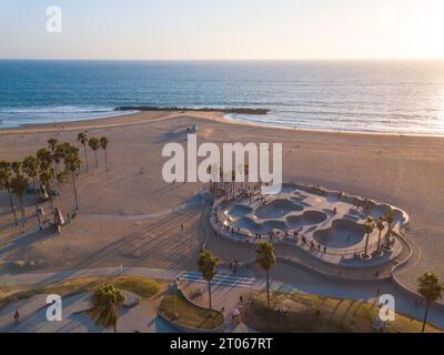 Aerial photos of the Venice Beach Skate Park taken with a drone during sunset. Long shadows of palm trees and skateboarders. Stock Photo