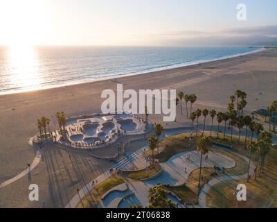 Aerial photos of the Venice Beach Skate Park taken with a drone during sunset. Long shadows of palm trees and skateboarders. Stock Photo