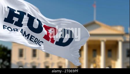 Washington D.C., US, June 22 2023: William Hurd 2024 presidential campaign flag waving with blurred White House in the background. Illustrative editor Stock Photo