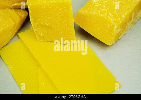 large pieces of natural beeswax, close-up, raw materials for candles Stock Photo