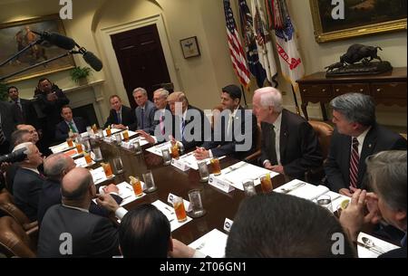 WASHINGTON, DC - MARCH 01: President Donald Trump (2nd R) hosts Office of Managment and Budget Director Mick Mulvaney (L) and Republican Congressional leaders (2nd L-R) Rep. Kevin McCarthy (R-CA); Senate Majority Leader Mitch McConnell (R-KY), Speaker of the House Paul Ryan (R-WI) and others during a working lunch in the Roosevelt Room at the White House March 1, 2017 in Washington, DC. The meeting comes the day after Trump layed out his policy priorities during a joint session of Congress. People: President Donald Trump, Mitch McConnell, Paul Ryan Stock Photo