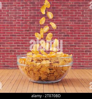 Creative layout made of healthy corn flakes falling into glass bowl against red brick wall background. Minimal breakfast food concept. Fancy breakfast Stock Photo