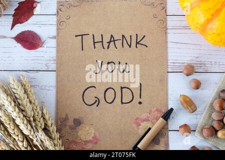 Thank You, LORD, handwritten note in hand over wooden background with ...