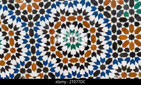 Traditional Morocco tiles with Islamic design, handcrafted colorful patterns like geometric shapes and floral motifs. These tiles are used to decorate Stock Photo