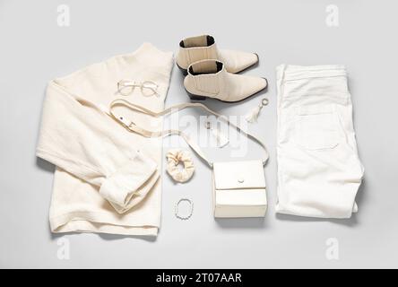 Composition with stylish female clothes, accessories and shoes on grey background Stock Photo