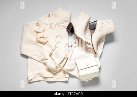 Composition with stylish female clothes, accessories and shoes on grey background Stock Photo