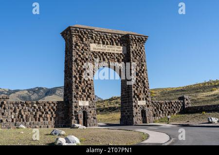 Historic Roosevelt Arch at the North Entrance of Yellowstone National Park, Gardiner Montana Stock Photo