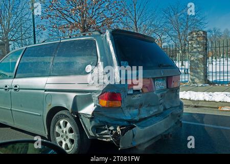 Car which has been in an accident resulting in a fender bender or a large dent. St Paul Minnesota MN USA Stock Photo