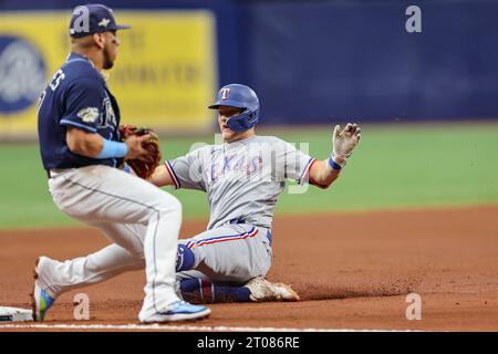 St. Petersburg, FL USA; Texas Rangers third baseman Josh Jung (6) triples during an MLB Wildcard game against the Tampa Bay Rays on Wednesday, October Stock Photo