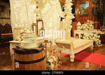 wedding set up setting cake and flowers white Stock Photo
