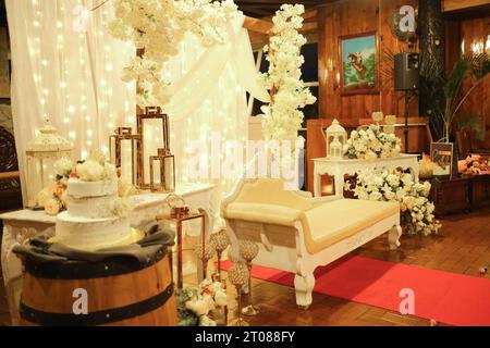 wedding set up setting cake and flowers white Stock Photo