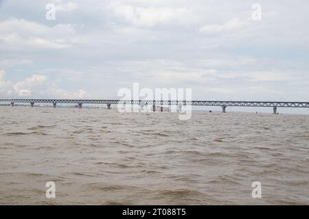 Traditional boat station, people's lifestyle, and cloudy sky photography captured on June 25, 2022, from Mawa boat station, Bangladesh Stock Photo
