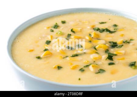 Corn soup in white bowl isolated on white background Stock Photo