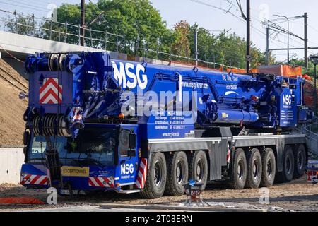 Blue mobile crane Liebherr LTM 1650-8.1 on construction site Stock Photo