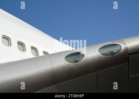 A Boeing 747-400 jumbo jet against a blue sky on a runway in Kemble, Gloucestershire, UK Stock Photo