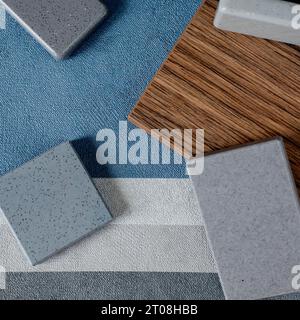 Close up combination of interior material containing set of artficial stone and wooden veneer samples. quartz stone and wooden laminated samples palet Stock Photo