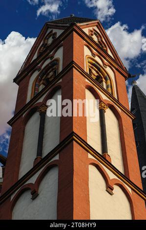 Brightly coloured square tower and slightly curving spire of Late Romanesque / Early Gothic Cathedral of Saint George in Limburg an der Lahn, Hesse, Germany. Stock Photo