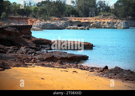 The rich earthy tones and textures of the jagged land formations in a beautiful north Australian bay. Stock Photo
