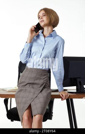 beautiful blonde business woman having phone conversation Stock Photo