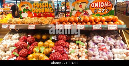 Jakarta, Indonesia - September 24 2023 : A display of fresh vegetables in the form of various types of onions and peanuts beautifully arranged in the Stock Photo