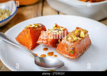 Roasted pumpkin sprinkled with pistachios Stock Photo