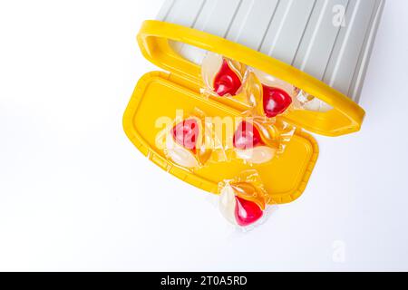 Laundry capsules and plastic containers isolated on white background. High quality photo Stock Photo