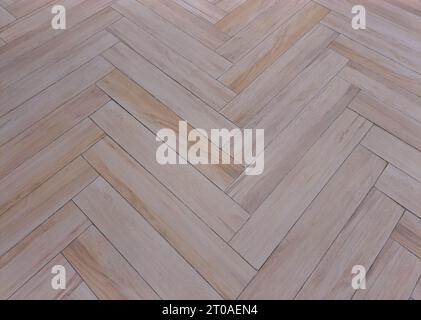 Herringbone or chevron flooring of Light Oak Tiles Stock Photo