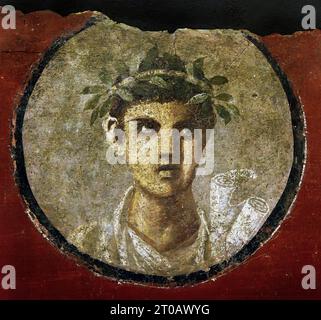 'Young Man with a Roll, 50-79 Fresco Pompeii Roman City is located near Naples in the Campania region of Italy. Pompeii was buried under 4-6 m of volcanic ash and pumice in the eruption of Mount Vesuvius in AD 79. Italy Stock Photo