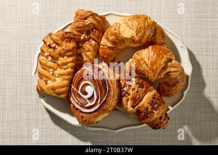 plate of assorted pastries on kitchen table, top view Stock Photo