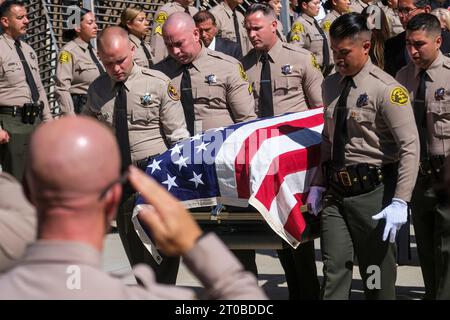 Los Angeles, United States. 05th Oct, 2023. The coffin of Los Angeles sheriff's deputy Ryan Clinkunbroomer is carried out at the Cathedral of Our Lady of the Angels. Clinkunbroomer was gunned down in his patrol vehicle last month near the Palmdale, Calif. Credit: SOPA Images Limited/Alamy Live News Stock Photo
